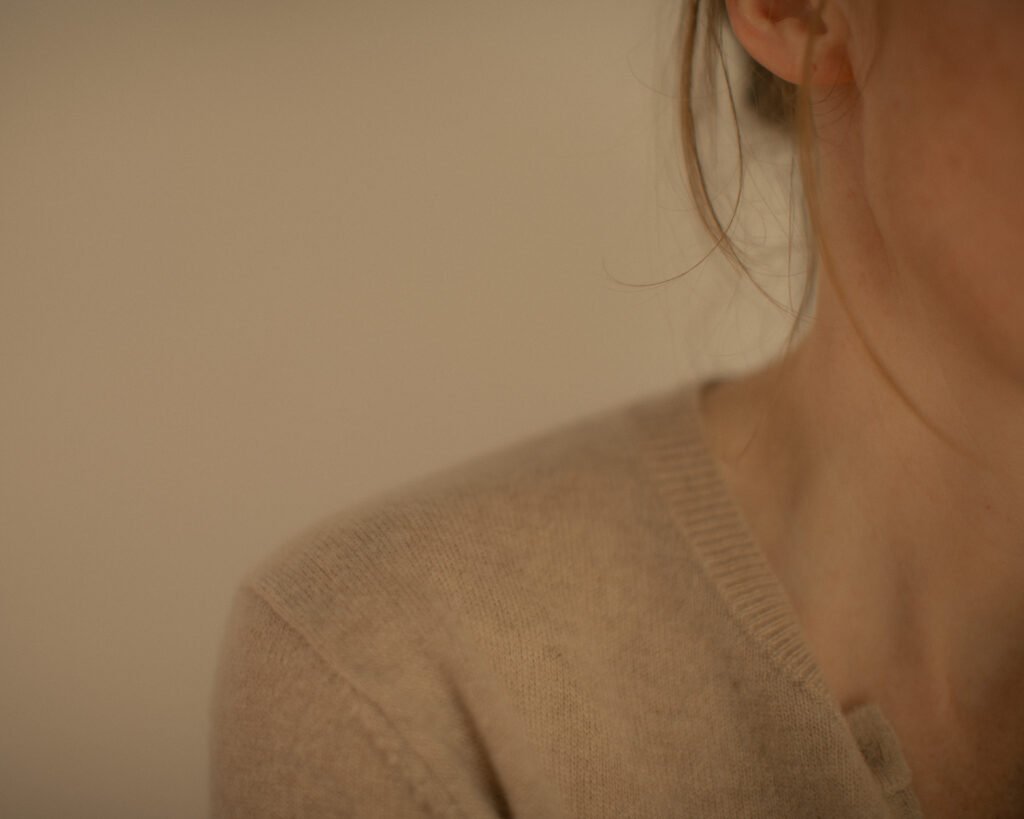 Soft luxury knitwear portrait with minimal composition by Anya Baro