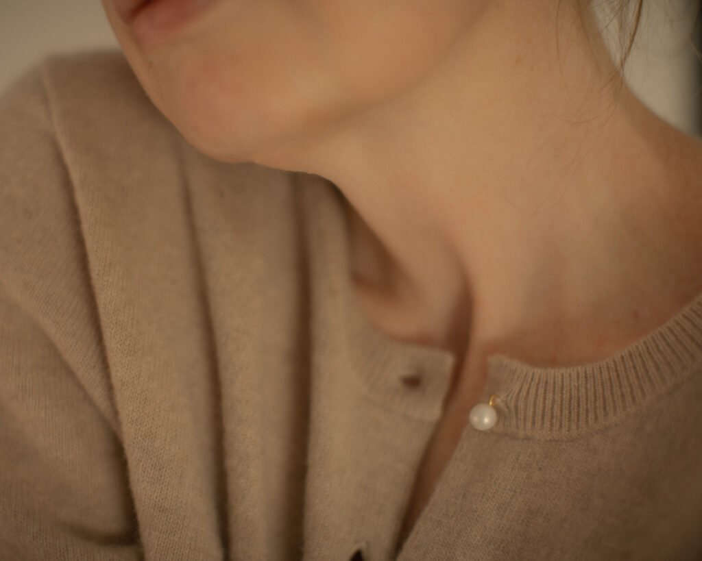 Cashmere knitwear portrait with sculptural light and soft texture by Anya Baro