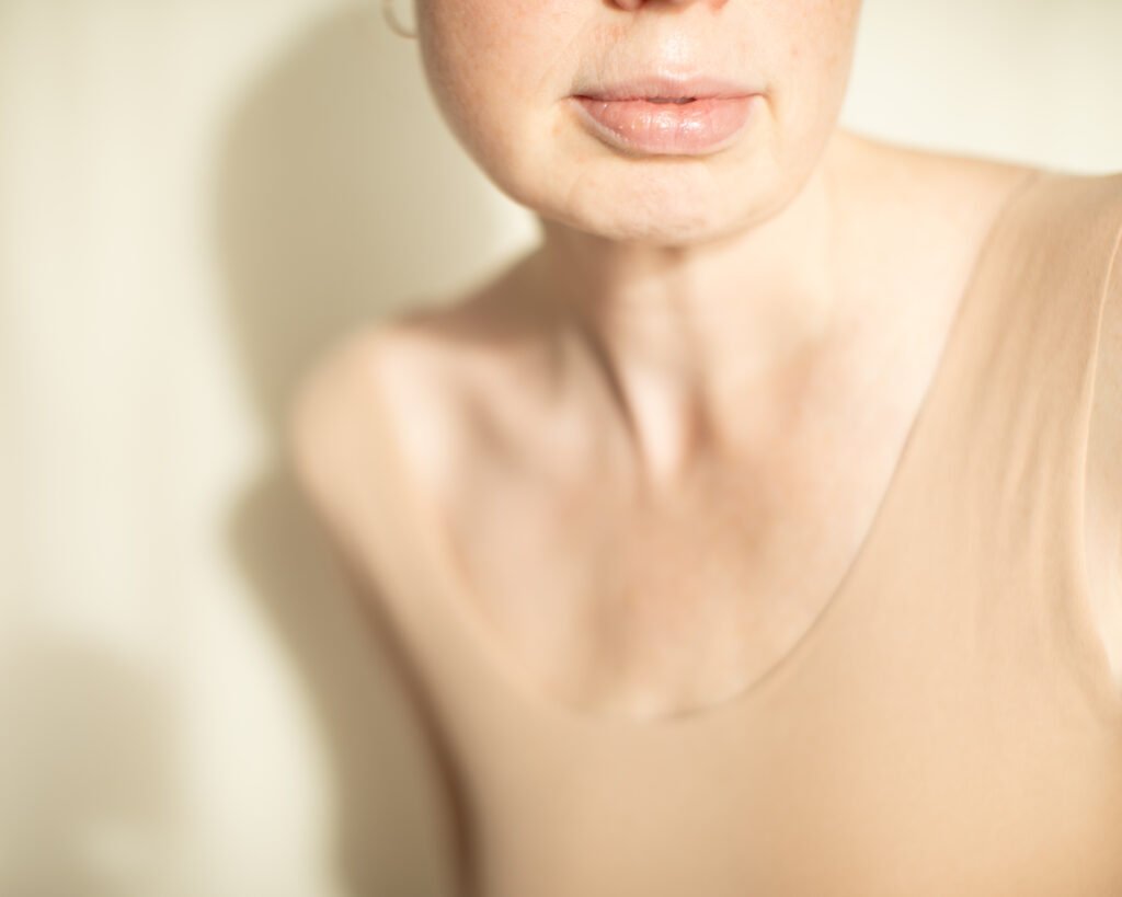 Minimal skincare portrait with soft skin tones and natural light