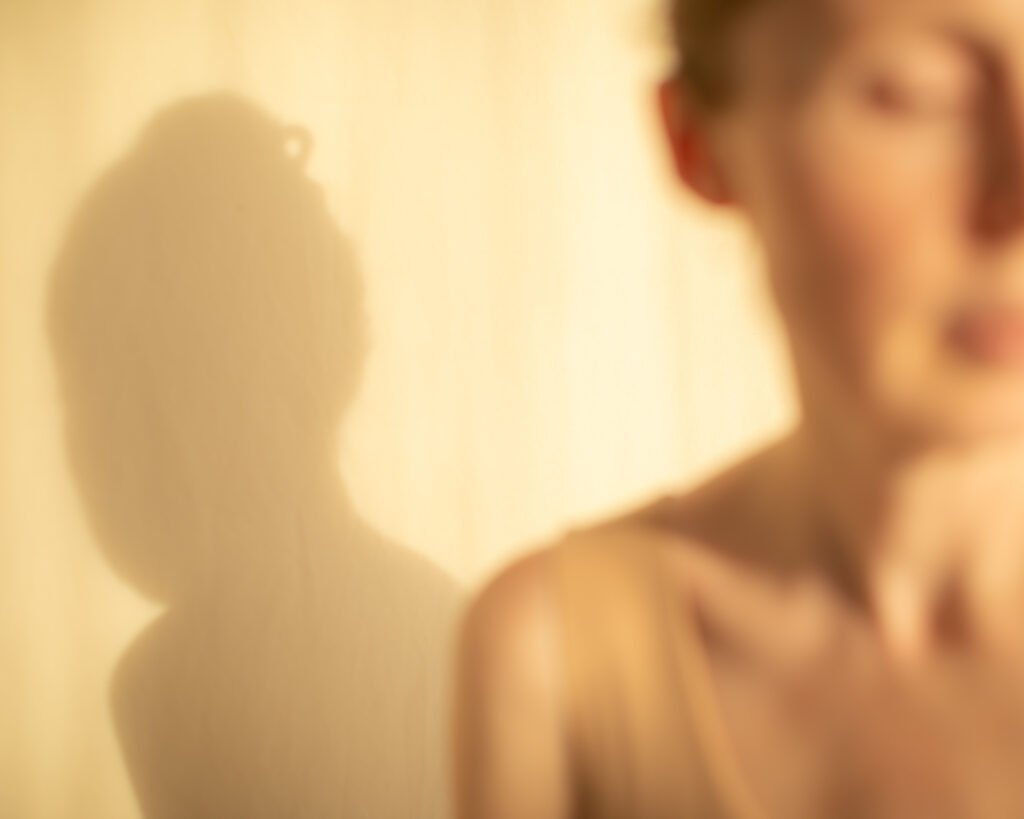 Soft skincare portrait with shadow and golden evening light