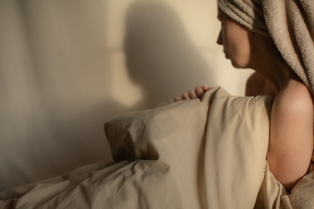 Woman enjoying a moment after shower in soft natural light